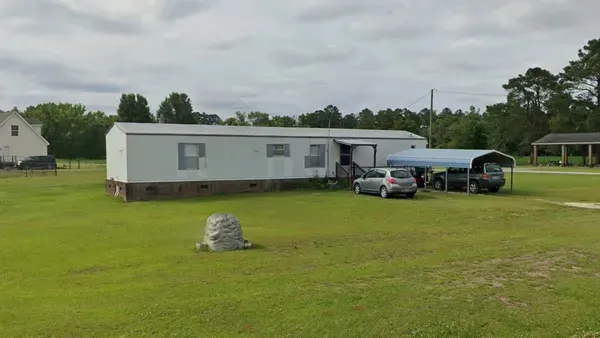 ¿En qué país se ve este tipo de casa móvil pequeña y rectangular?