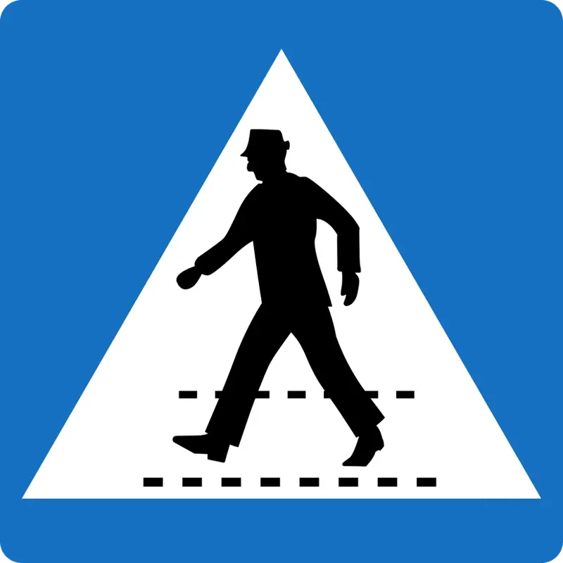 ¿En qué país se ve esta señal de cruce peatonal con las franjas del paso horizontales?